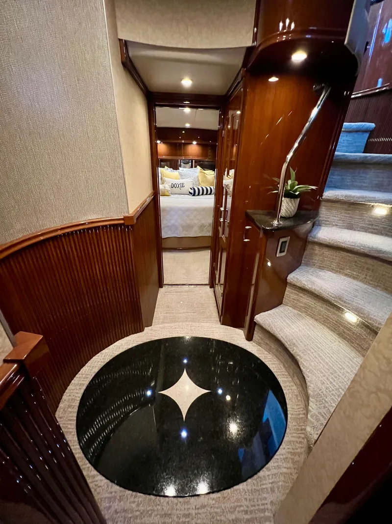 Slide: The Image of Luxurious interior of a 2005 Marquis 59 yacht with elegant staircase. - 20