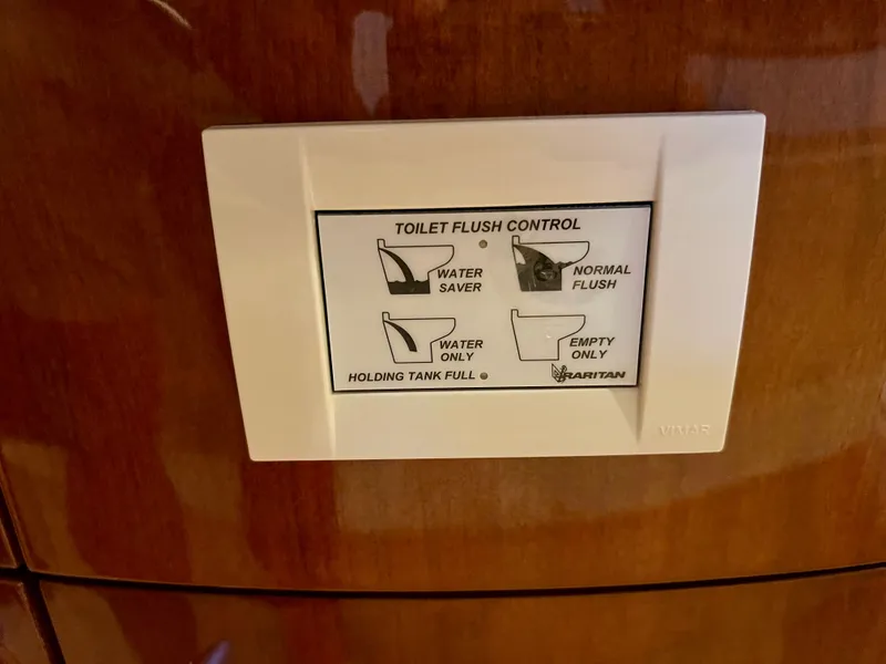 Slide: The Image of Toilet flush control in a 2005 Marquis 59 boat. - 27