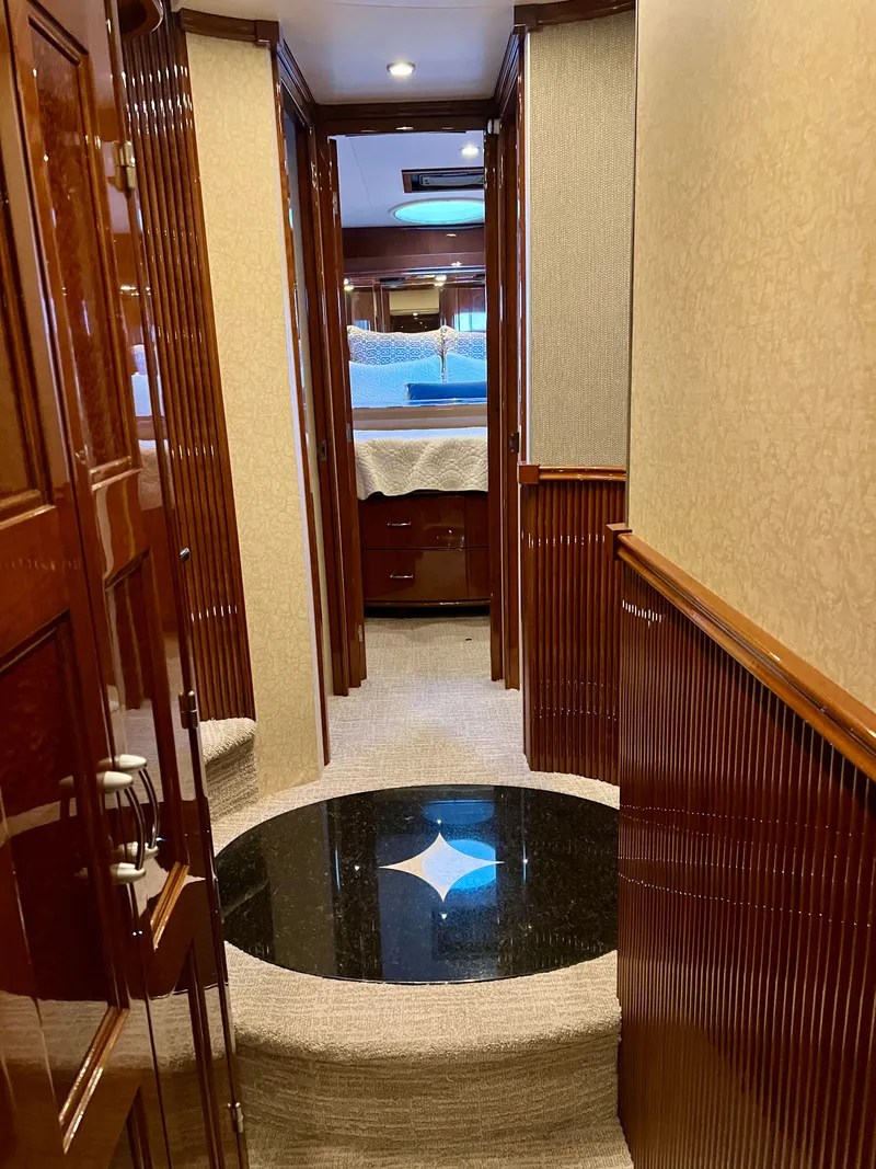 Slide: The Image of Luxurious interior of a 2005 Marquis 59 yacht with wooden walls. - 28