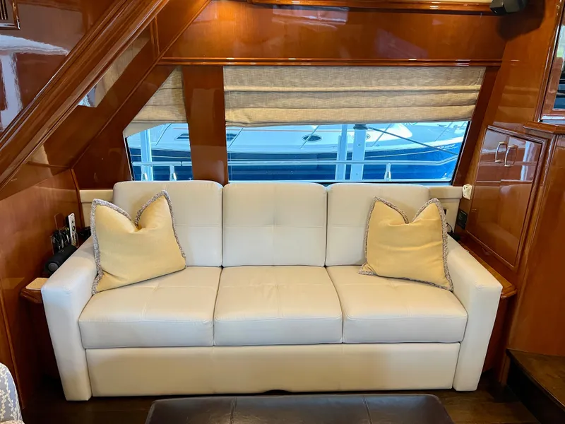 Slide: The Image of Luxurious interior of a 2005 Marquis 59 yacht with beige sofa. - 3