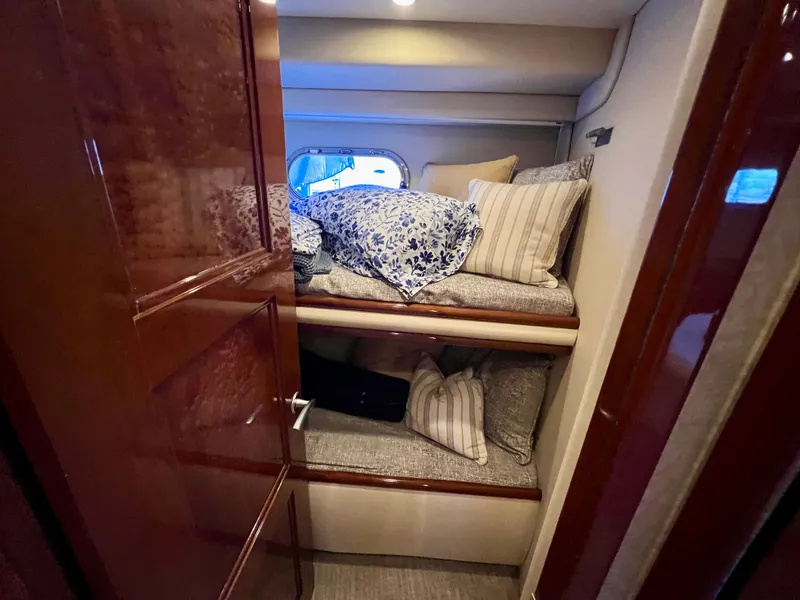 Slide: The Image of Interior of a 2005 Marquis 59 yacht with bunk beds. - 30