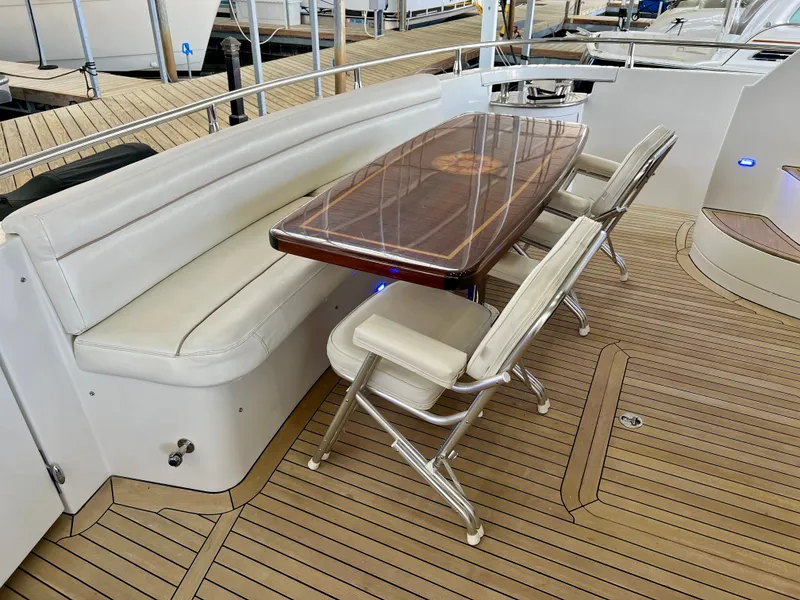 Slide: The Image of Luxurious dining area on a 2005 Marquis 59 yacht. - 35