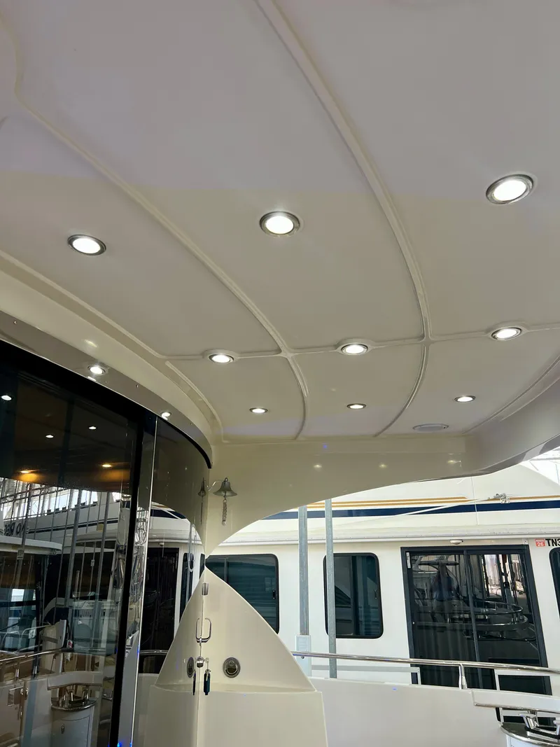 Slide: The Image of Interior view of a 2005 Marquis 59 yacht with ceiling lights. - 38