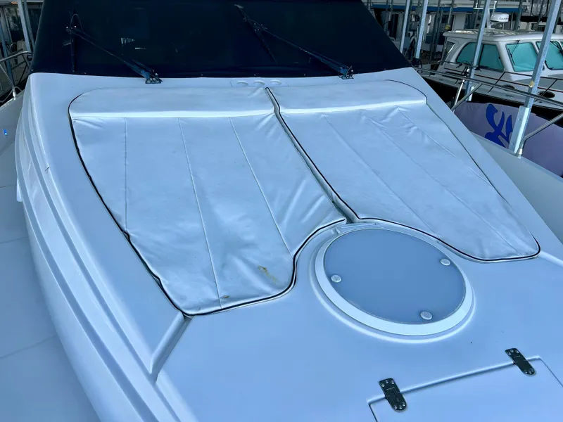 Slide: The Image of 2005 Marquis 59 yacht with sunshade on the deck. - 43