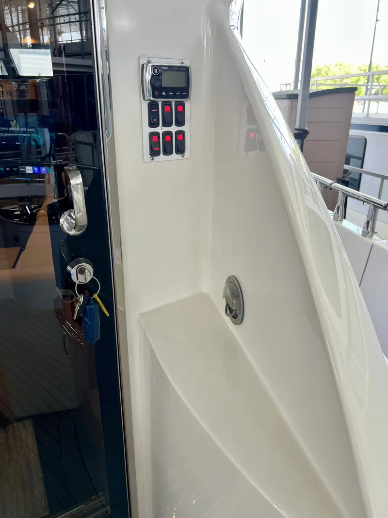 Slide: The Image of Control panel of a 2005 Marquis 59 yacht with keys. - 47