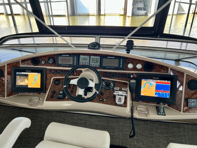 Slide: The Image of 2005 Marquis 59 yacht helm with navigation systems. - 49
