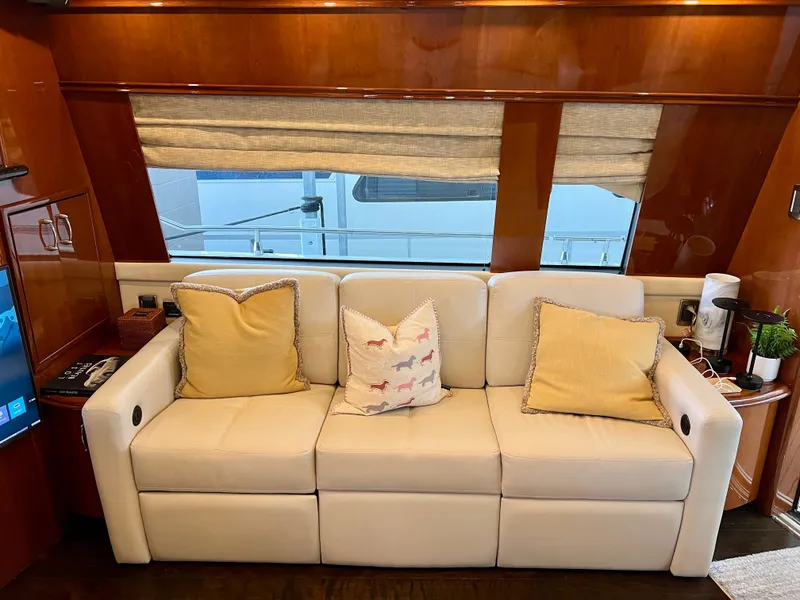 Slide: The Image of Luxurious interior of a 2005 Marquis 59 yacht with comfortable leather couch. - 5