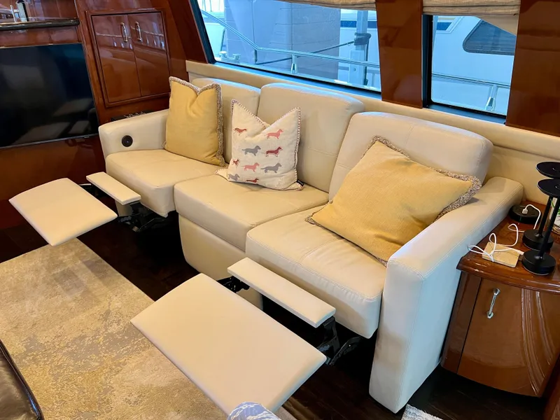 Slide: The Image of Luxurious interior of a 2005 Marquis 59 yacht with beige leather sofas. - 6