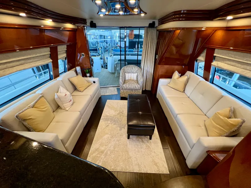 Slide: The Image of Luxurious interior of a 2005 Marquis 59 yacht with elegant sofas. - 9