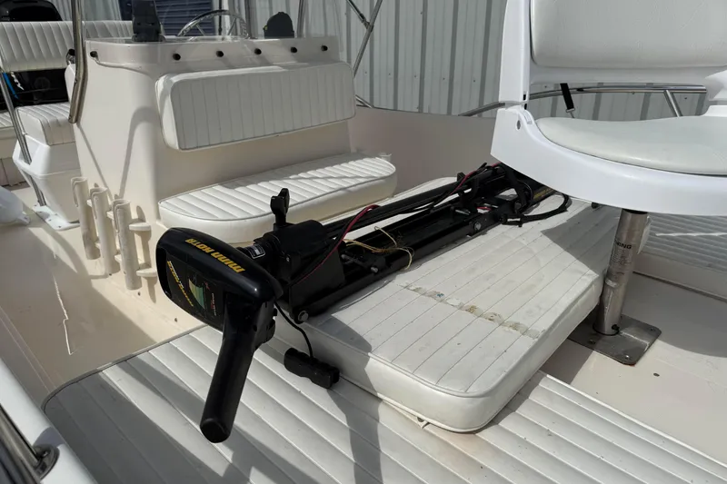 Slide: The Image of 2002 McKee Craft WayPoint boat interior with seating and trolling motor. - 10