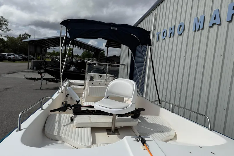 Slide: The Image of 2002 McKee Craft WayPoint boat with canopy at Toho Marine dealership. - 13