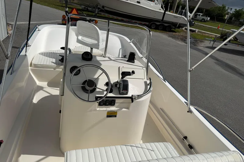 Slide: The Image of 2002 McKee Craft WayPoint boat interior with steering console and seating. - 5