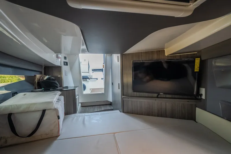 Slide: The Image of Interior of 2025 Navan S30 boat with TV, seating, and modern design elements. - 62