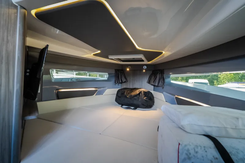 Slide: The Image of Luxurious interior cabin of 2025 Navan S30 boat with modern lighting and comfortable bedding. - 63
