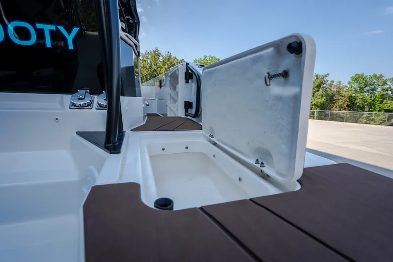 Slide: The Image of Open storage compartment on 2025 Navan S30 boat deck, featuring sleek design and modern materials. - 15