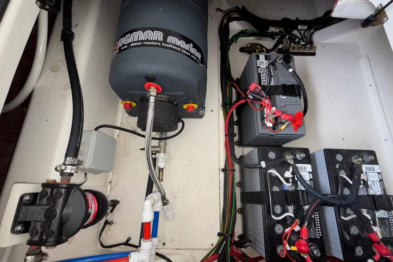Slide: The Image of Electrical and plumbing components inside a Navan S30, 2025 model. - 24