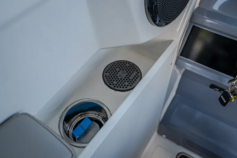 Slide: The Image of Interior detail of 2025 Navan S30 boat, featuring speaker and compartment with keys. - 46