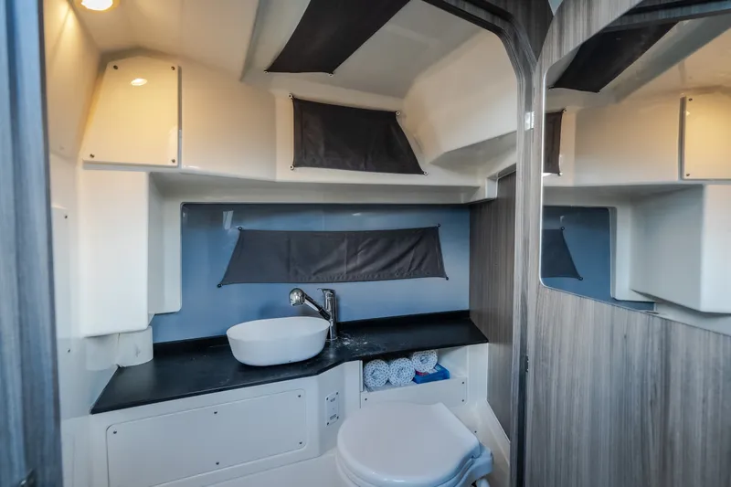 Slide: The Image of Modern bathroom interior in 2025 Navan S30 boat, featuring sleek sink and compact design. - 64