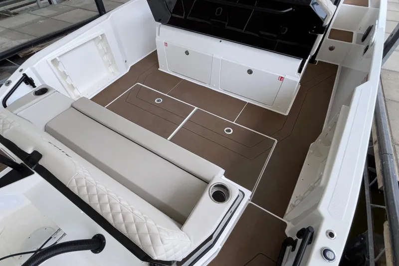 Slide: The Image of Spacious interior of 2025 Navan S30 boat with cushioned seating and storage compartments. - 14