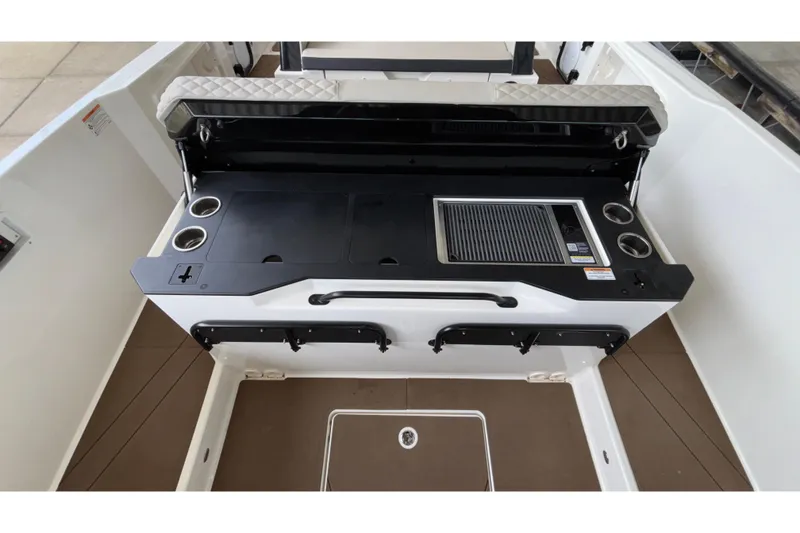 Slide: The Image of 2025 Navan S30 boat interior with built-in grill and cup holders. - 31