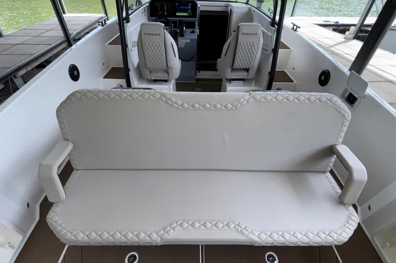 Slide: The Image of Interior of 2025 Navan S30 boat with cushioned seating and modern dashboard. - 28