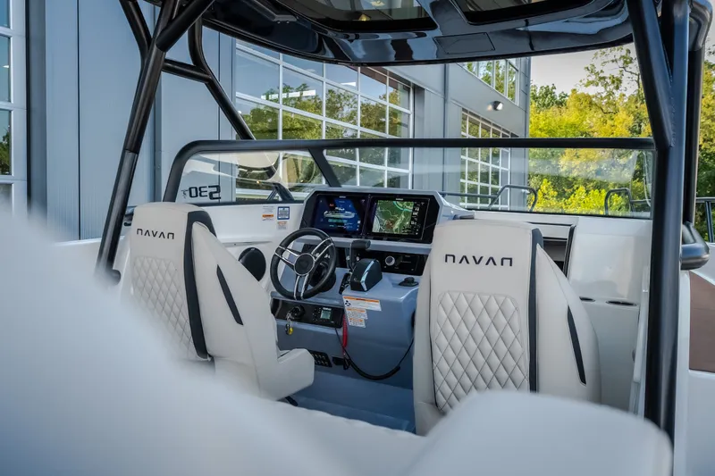 Slide: The Image of Interior view of 2025 Navan S30 boat, featuring modern dashboard and luxurious seating. - 25