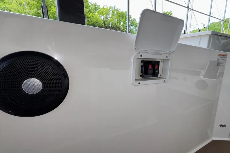 Slide: The Image of Interior of 2025 Navan S30 boat with speaker and electrical panel. - 34