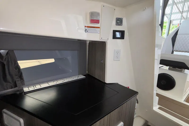 Slide: The Image of Interior of 2025 Navan S30 boat with modern control panel and seating. - 63