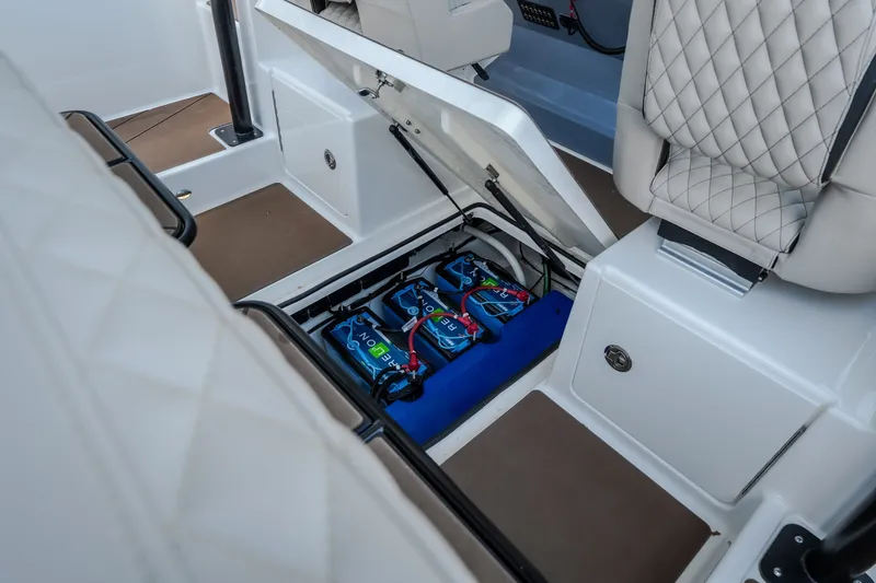 Slide: The Image of 2025 Navan S30 boat interior showing battery compartment with neatly arranged lithium batteries. - 45