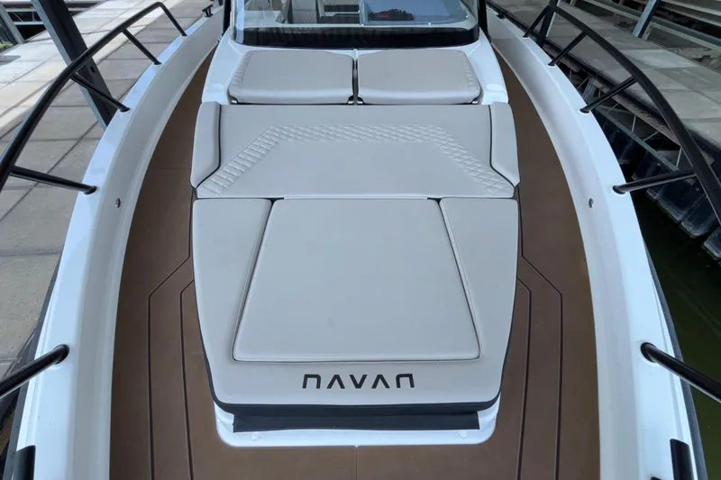 Slide: The Image of 2025 Navan S30 boat deck with cushioned seating and sleek design. - 52