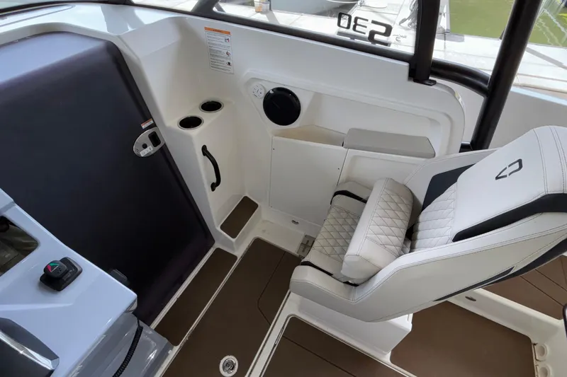 Slide: The Image of Interior of 2025 Navan S30 boat with modern seating and controls. - 42