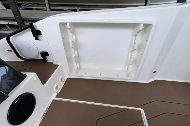 Slide: The Image of Interior view of 2025 Navan S30 boat, featuring storage compartment and speaker. - 26