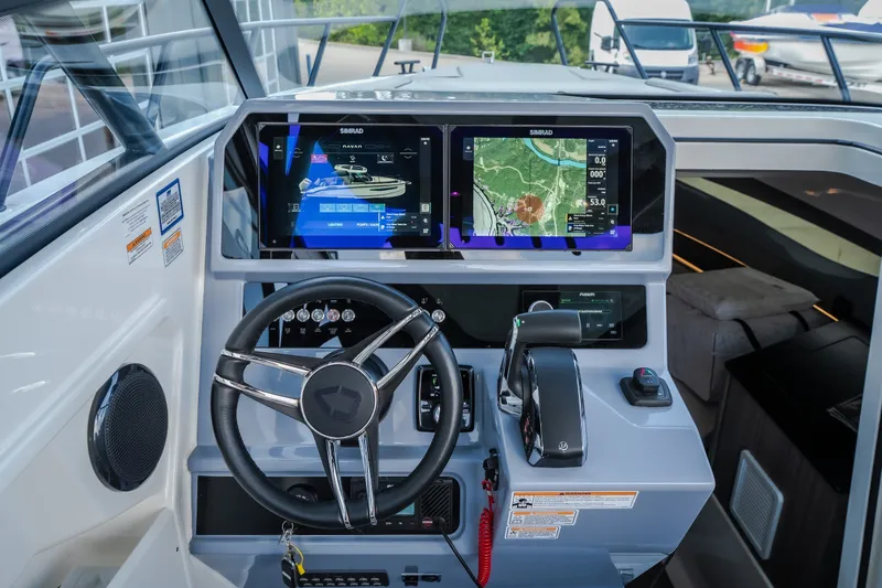 Slide: The Image of 2025 Navan S30 boat cockpit with advanced navigation displays and controls. - 30