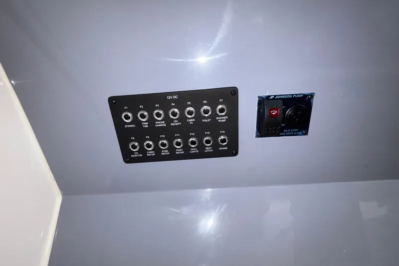 Slide: The Image of Control panel of a 2025 Navan S30 boat with switches and Johnson pump. - 61