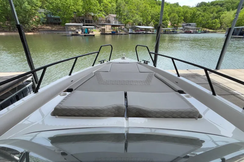 Slide: The Image of Bow view of 2025 Navan S30 boat docked by a scenic lakeside. - 50