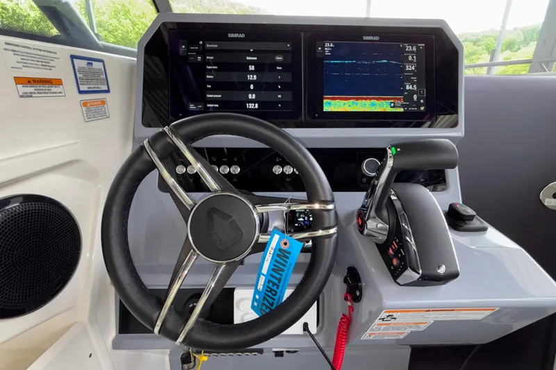 Slide: The Image of Steering console of 2025 Navan S30 boat with advanced navigation displays. - 46