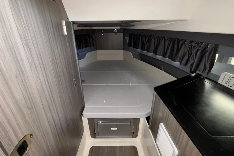 Slide: The Image of Interior of 2025 Navan S30 boat cabin with bed and storage. - 65