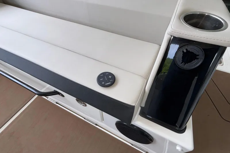 Slide: The Image of Interior of 2025 Navan S30 boat with seating, cup holder, and control panel. - 21