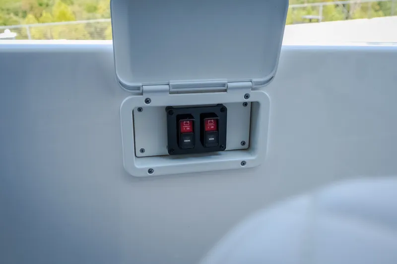 Slide: The Image of Control panel with switches on a 2025 Navan S30 boat. - 39