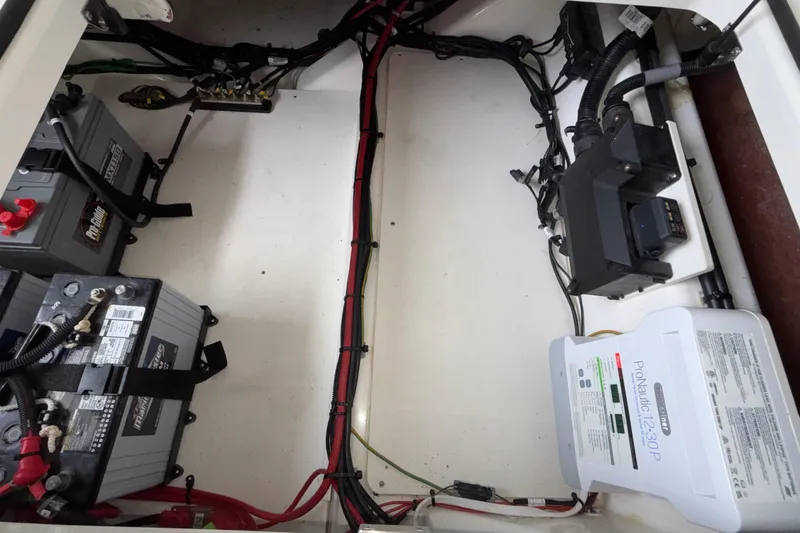 Slide: The Image of Electrical system of 2025 Navan S30 boat with batteries and wiring components. - 23