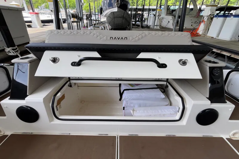 Slide: The Image of Open storage compartment on 2025 Navan S30 boat at marina. - 19
