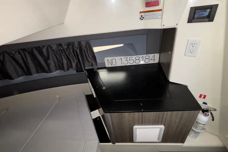 Slide: The Image of Interior of 2025 Navan S30 showing a compact sleeping area with storage and safety features. - 66