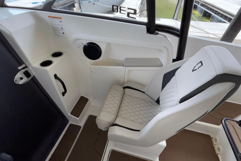 Slide: The Image of 2025 Navan S30 boat interior with modern seating and control panel. - 43