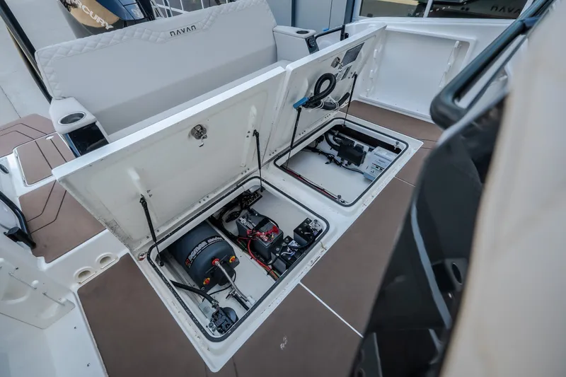 Slide: The Image of 2025 Navan S30 boat storage compartments with electrical components and wiring. - 43