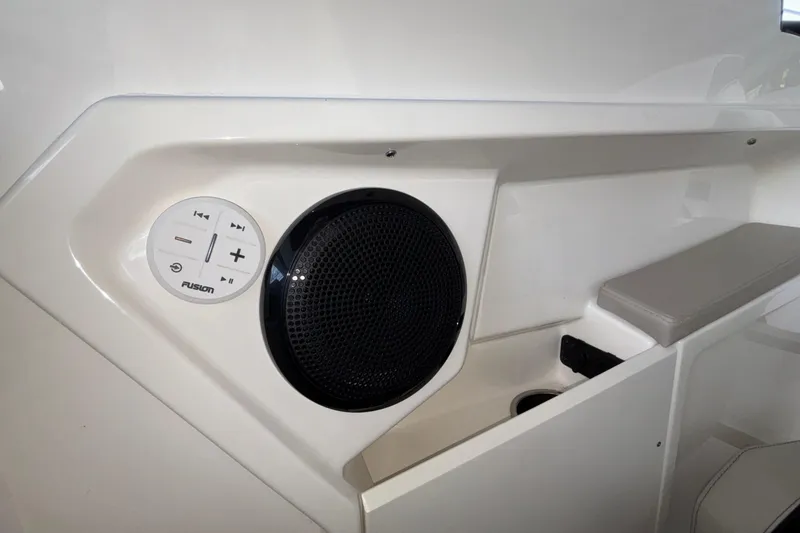 Slide: The Image of Interior of 2025 Navan S30 boat featuring a Fusion audio system and seating area. - 51