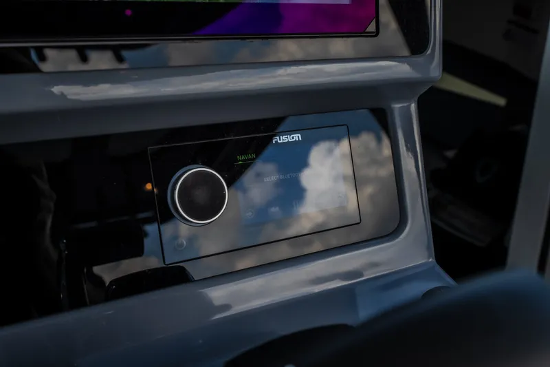 Slide: The Image of Dashboard of 2025 Navan S30 with digital display and control knob. - 33