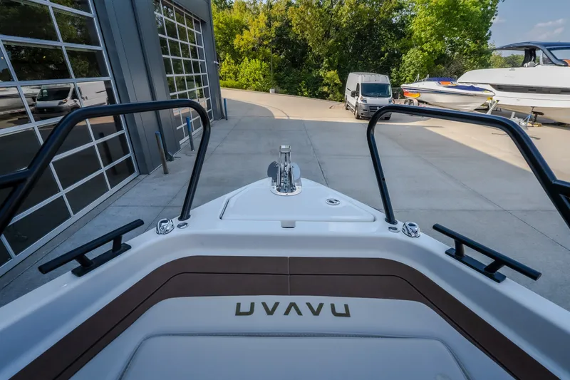 Slide: The Image of Bow view of 2025 Navan S30 boat at a marina with surrounding greenery. - 57