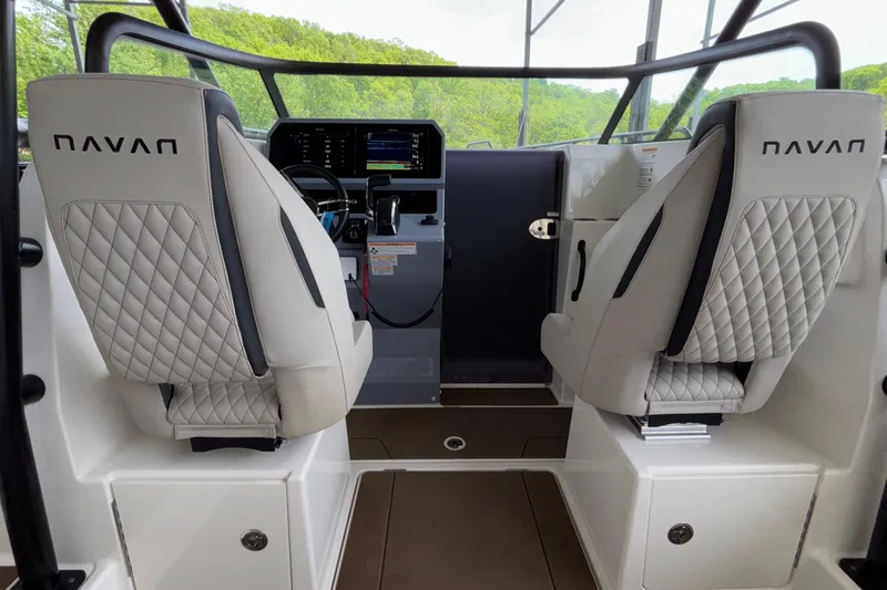 Slide: The Image of Interior of 2025 Navan S30 boat with modern dashboard and quilted seats. - 38