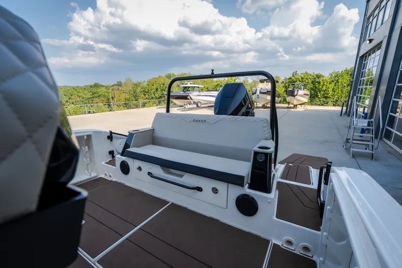 Slide: The Image of 2025 Navan S30 boat interior with modern seating and sleek design, docked outdoors. - 41