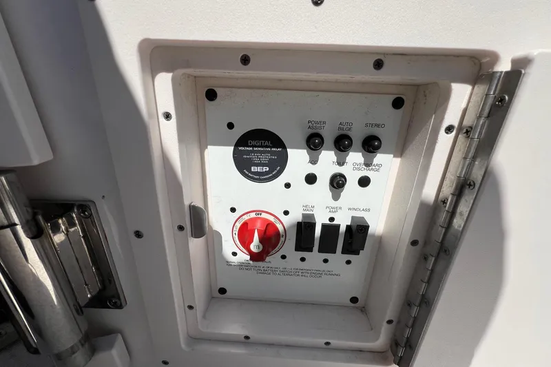 Slide: The Image of Control panel of a 2018 ROBALLO R242 boat with various switches and indicators. - 14